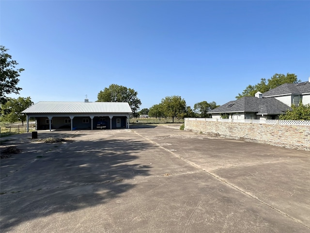view of parking / parking lot with fence