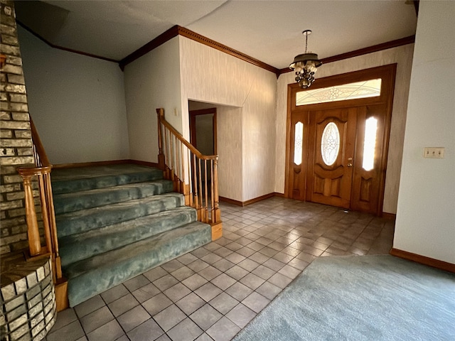 foyer featuring stairs, tile patterned flooring, baseboards, ornamental molding, and an inviting chandelier
