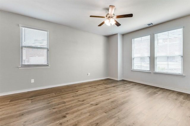 2004 Saddle Way, Mesquite, TX 75149 - spare room with visible vents, baseboards, a ceiling fan, and wood finished floors