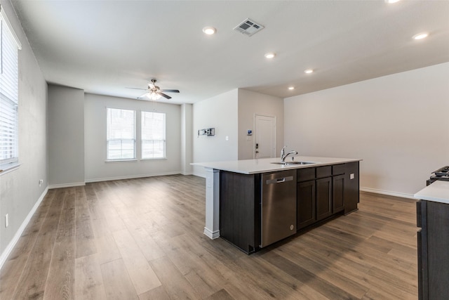 2004 Saddle Way, Mesquite, TX 75149 - kitchen featuring visible vents, dishwasher, a sink, light countertops, and an island with sink