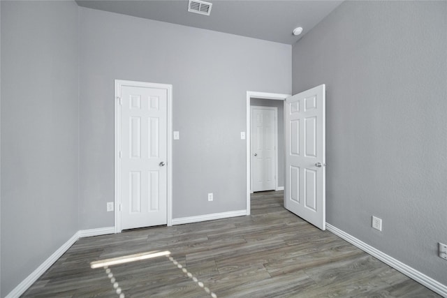 116 Birdbrook Dr, Anna, TX 75409 - unfurnished bedroom featuring baseboards, visible vents, and wood finished floors