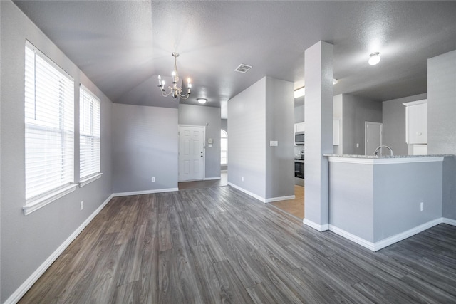 116 Birdbrook Dr, Anna, TX 75409 - interior space featuring an inviting chandelier, dark wood finished floors, baseboards, and visible vents