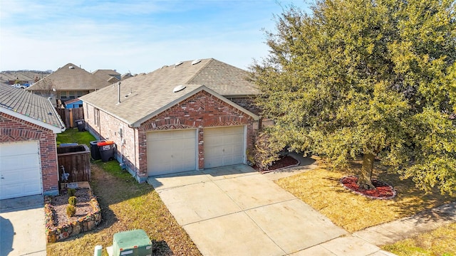 116 Birdbrook Dr, Anna, TX 75409 - view of front of home with concrete driveway, roof with shingles, an attached garage, fence, and brick siding
