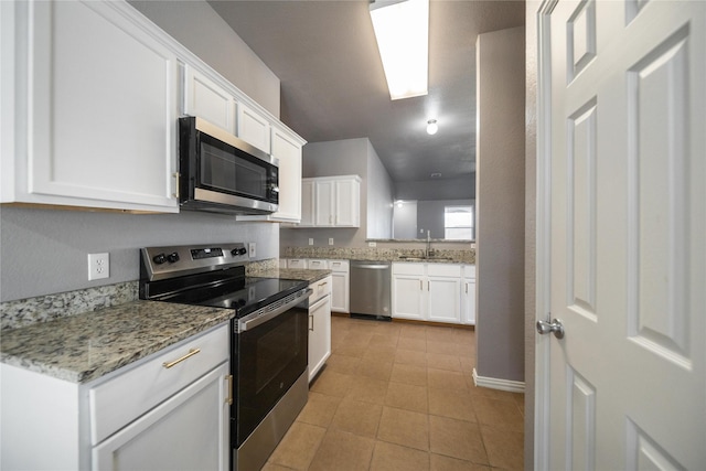 116 Birdbrook Dr, Anna, TX 75409 - kitchen with white cabinetry, a sink, light tile patterned floors, and appliances with stainless steel finishes