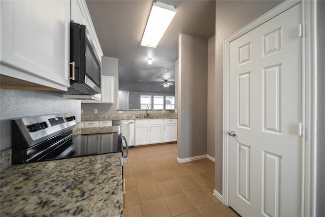 116 Birdbrook Dr, Anna, TX 75409 - kitchen with white cabinetry, stainless steel appliances, a sink, light tile patterned flooring, and light stone counters