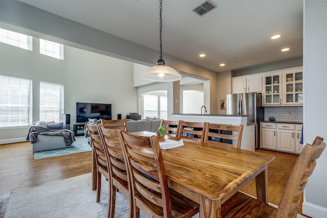 8106 Persimmon St, Irving, TX 75063 - dining space featuring recessed lighting, plenty of natural light, light wood-type flooring, and baseboards