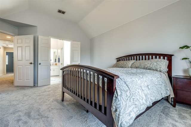 8106 Persimmon St, Irving, TX 75063 - bedroom with light colored carpet, lofted ceiling, and ensuite bathroom