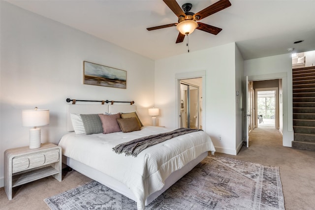bedroom with ceiling fan, baseboards, and carpet flooring