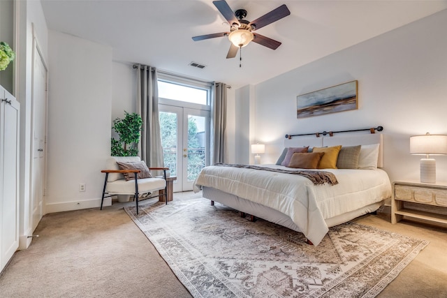 bedroom with light carpet, a ceiling fan, visible vents, and access to exterior
