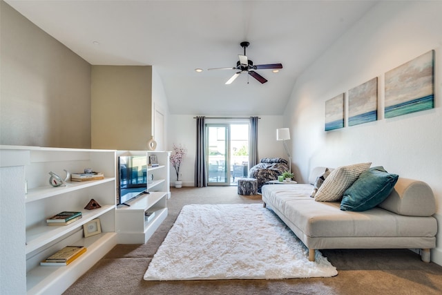 carpeted living room featuring vaulted ceiling and ceiling fan
