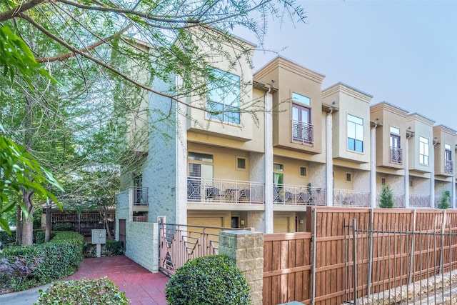 view of building exterior with fence private yard