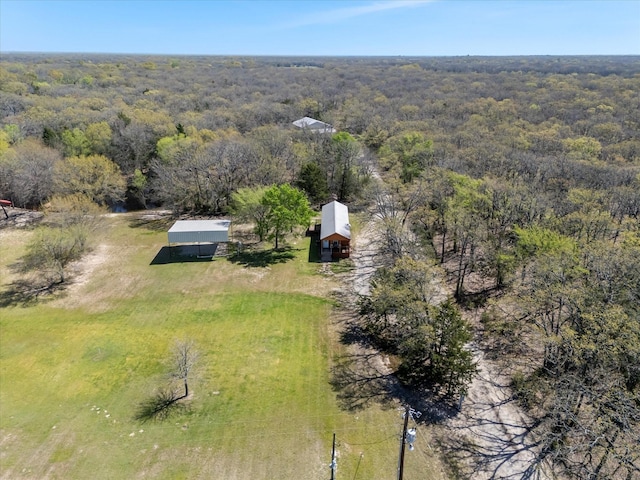 aerial view featuring a view of trees