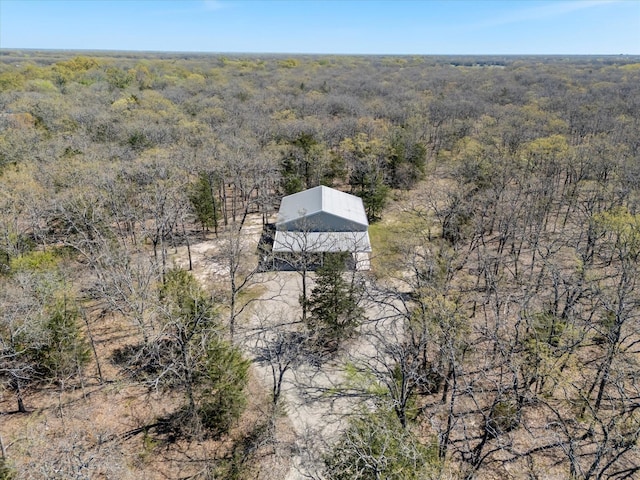 aerial view featuring a wooded view