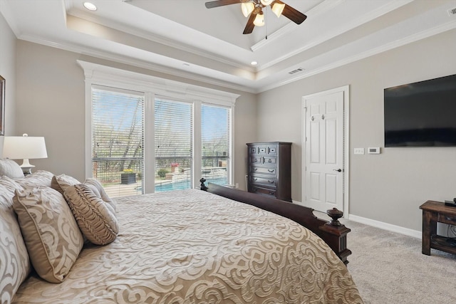 carpeted bedroom with ornamental molding, baseboards, a tray ceiling, a ceiling fan, and recessed lighting