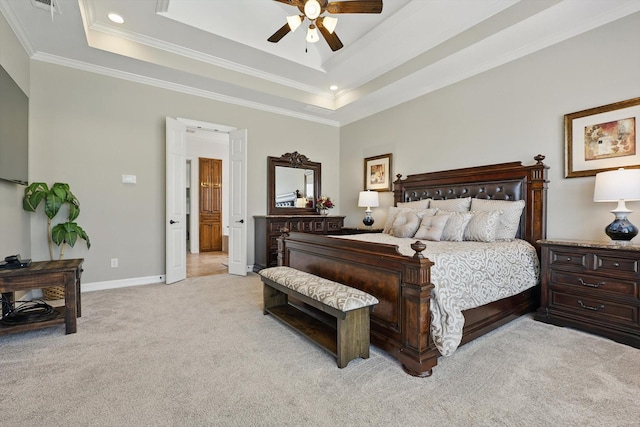 bedroom featuring light colored carpet, crown molding, a tray ceiling, baseboards, and recessed lighting