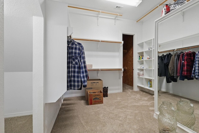 spacious closet featuring carpet floors