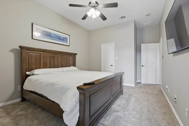 bedroom with light carpet, baseboards, and a ceiling fan