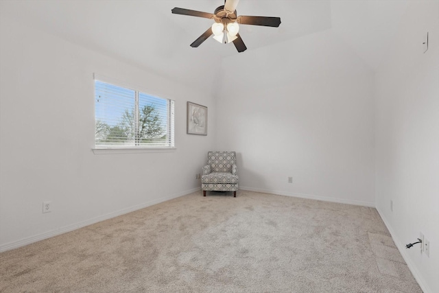 unfurnished room featuring carpet, vaulted ceiling, ceiling fan, and baseboards