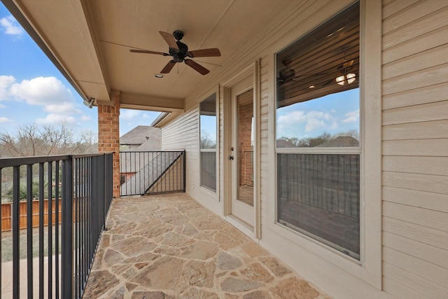 balcony featuring a ceiling fan