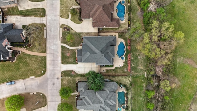 aerial view of property and surrounding area with a pool