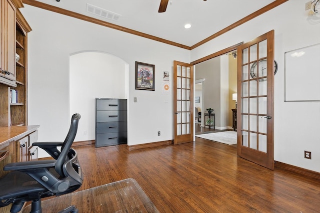home office with dark wood-style flooring, crown molding, arched walkways, baseboards, and french doors