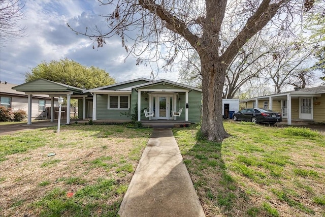 1602 Marion Dr, Garland, TX 75042 - bungalow with a front yard and covered porch