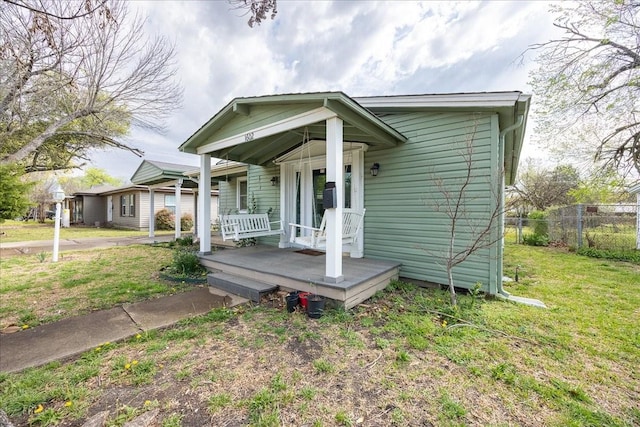 1602 Marion Dr, Garland, TX 75042 - bungalow featuring fence, a front lawn, and a porch