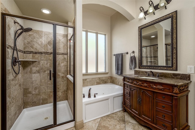 681 Harper Dr, Fate, TX 75087 - bathroom featuring a garden tub, a stall shower, vanity, and tile patterned floors