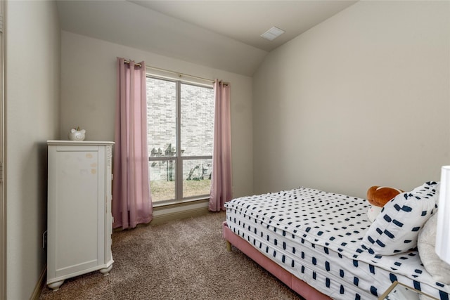 681 Harper Dr, Fate, TX 75087 - carpeted bedroom featuring multiple windows and vaulted ceiling