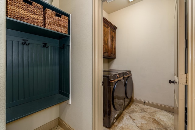 681 Harper Dr, Fate, TX 75087 - washroom featuring washing machine and dryer, cabinet space, baseboards, and light tile patterned floors