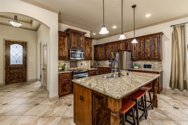 681 Harper Dr, Fate, TX 75087 - kitchen with stainless steel appliances, a sink, arched walkways, crown molding, and recessed lighting