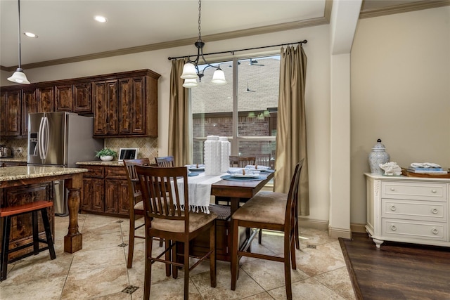 681 Harper Dr, Fate, TX 75087 - dining room featuring ornamental molding, recessed lighting, and a chandelier