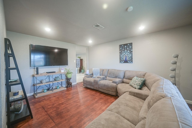living room with wood finished floors, recessed lighting, baseboards, and visible vents