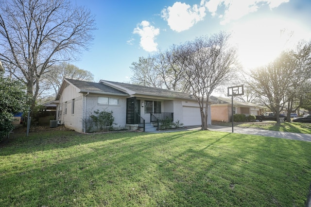 ranch-style home featuring concrete driveway, central air condition unit, an attached garage, a front lawn, and brick siding