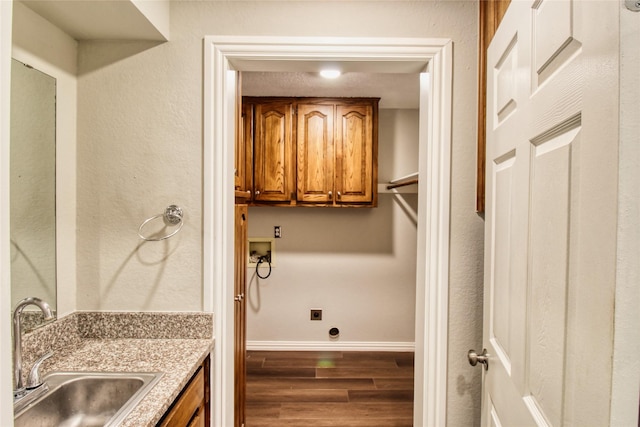 112 Woodcrest St, Weatherford, TX 76087 - laundry room featuring hookup for a washing machine, cabinet space, hookup for an electric dryer, wood finished floors, and baseboards