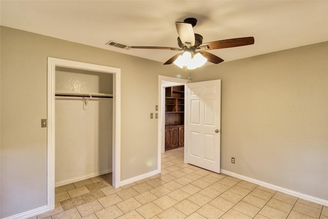 112 Woodcrest St, Weatherford, TX 76087 - unfurnished bedroom featuring a closet, light tile patterned flooring, baseboards, and ceiling fan