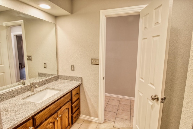 112 Woodcrest St, Weatherford, TX 76087 - bathroom featuring vanity, tile patterned floors, and baseboards