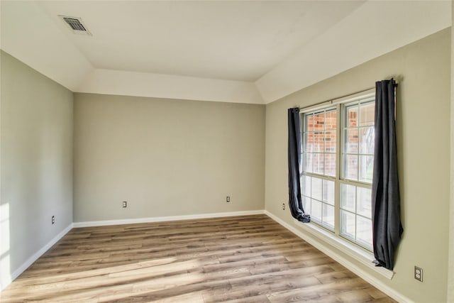 112 Woodcrest St, Weatherford, TX 76087 - spare room featuring baseboards, light wood-style flooring, and vaulted ceiling