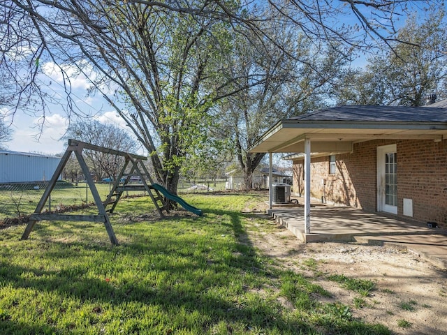 175 Clover Ln, Decatur, TX 76234 - view of yard with a playground, central AC unit, fence, and a patio