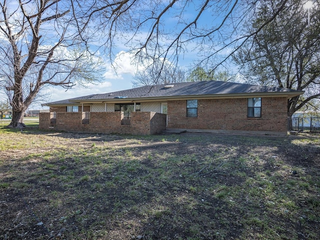175 Clover Ln, Decatur, TX 76234 - back of property featuring brick siding and fence