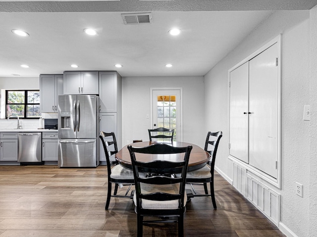 175 Clover Ln, Decatur, TX 76234 - dining area featuring wood finished floors, recessed lighting, and visible vents