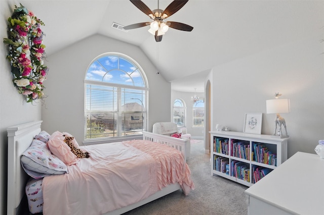 carpeted bedroom with lofted ceiling, ceiling fan, and visible vents