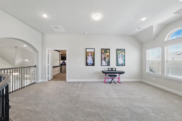 interior space featuring baseboards, vaulted ceiling, recessed lighting, and carpet