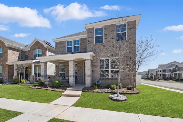 6028 Bowie Ct, Providence Village, TX 76227 - view of front of house with brick siding, a front lawn, a residential view, and a porch