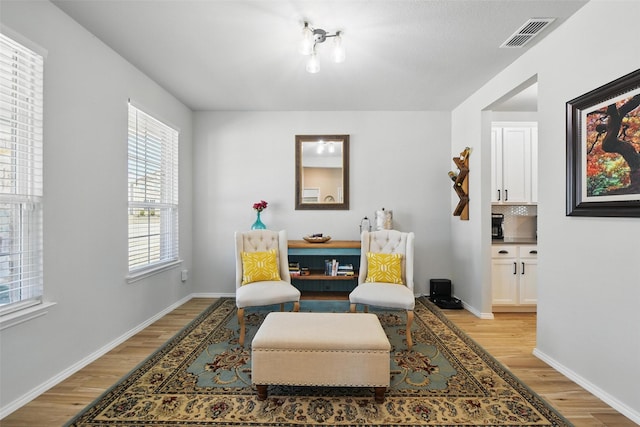6028 Bowie Ct, Providence Village, TX 76227 - sitting room with light wood-style flooring and baseboards