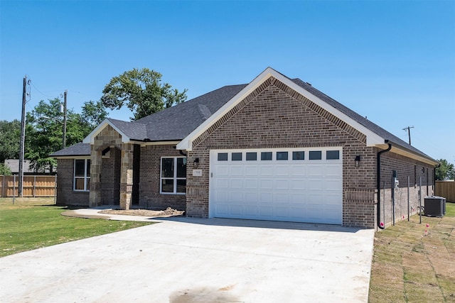 719 Cobblestone Cir, Mabank, TX 75147 - ranch-style home featuring a garage, brick siding, central AC unit, and concrete driveway