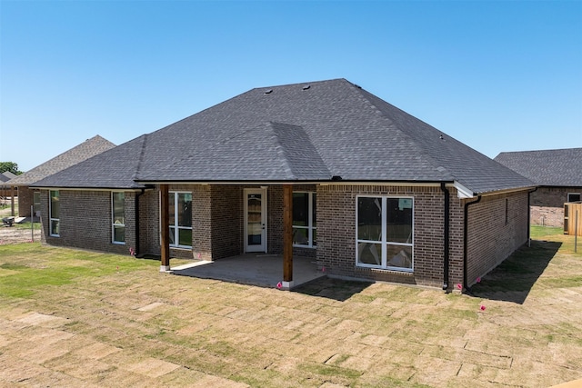 719 Cobblestone Cir, Mabank, TX 75147 - rear view of property with a shingled roof, brick siding, a patio area, and a yard