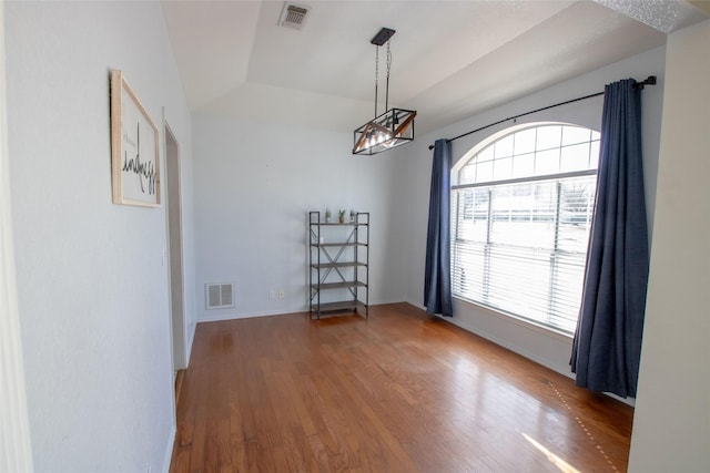 514 Preston Dr, Pottsboro, TX 75076 - spare room with baseboards, visible vents, a notable chandelier, and wood finished floors