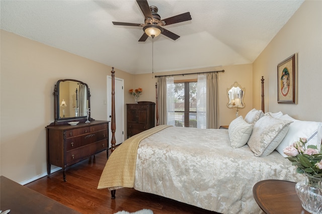 bedroom featuring lofted ceiling, dark wood finished floors, and a ceiling fan