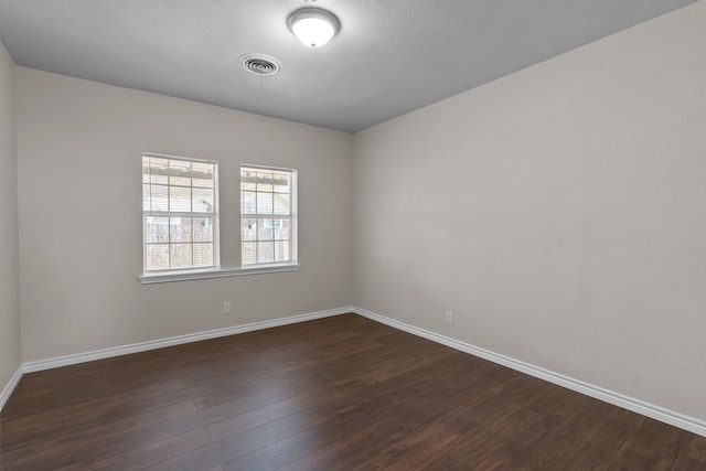 4601 Virginia Ln, Fort Worth, TX 76103 - unfurnished room featuring dark wood-style floors and baseboards